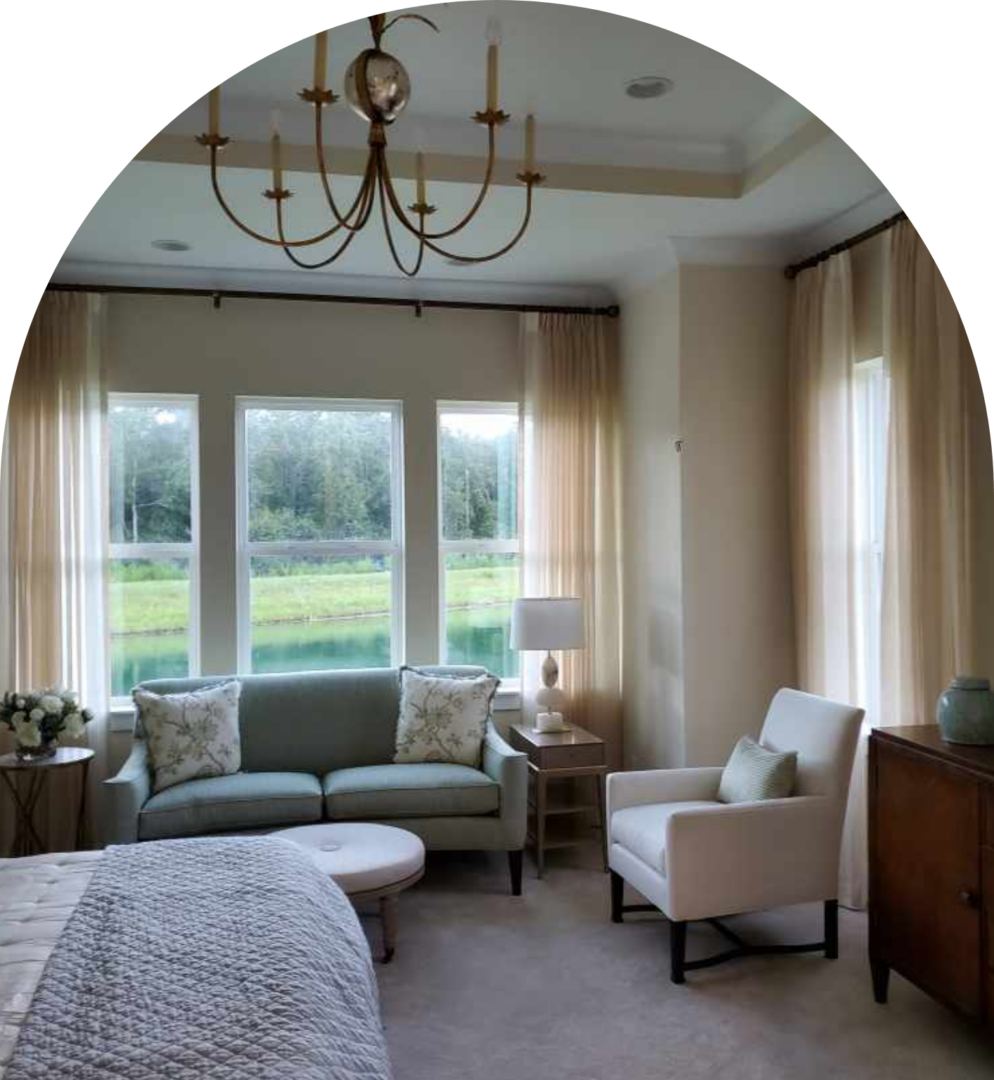 A living room with two chairs and a couch